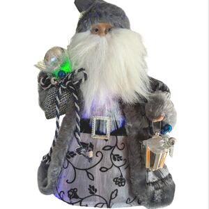 - Fibre Optic Santa tree topper. Plug in.  Ceramic face and hands .EUC
